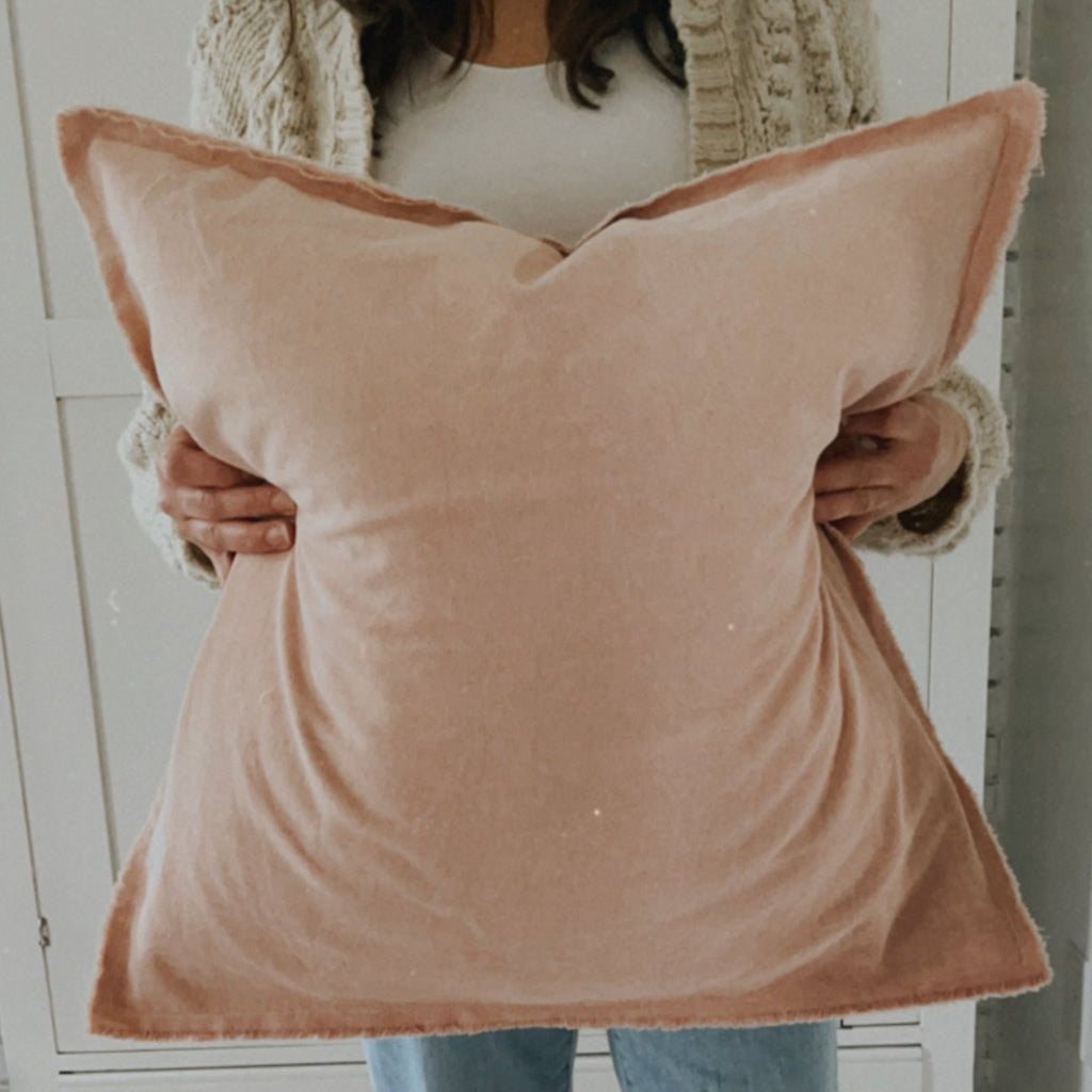 pink raw edge throw pillow 
