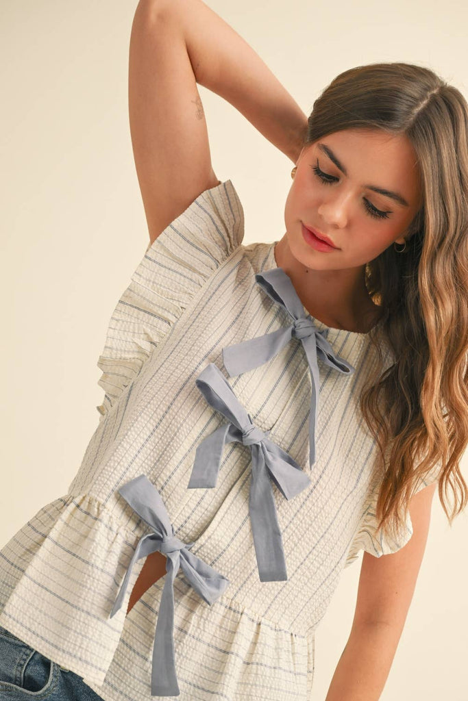 STRIPED WITH TIE FRONT RUFFLE SLEEVELESS BLOUSE