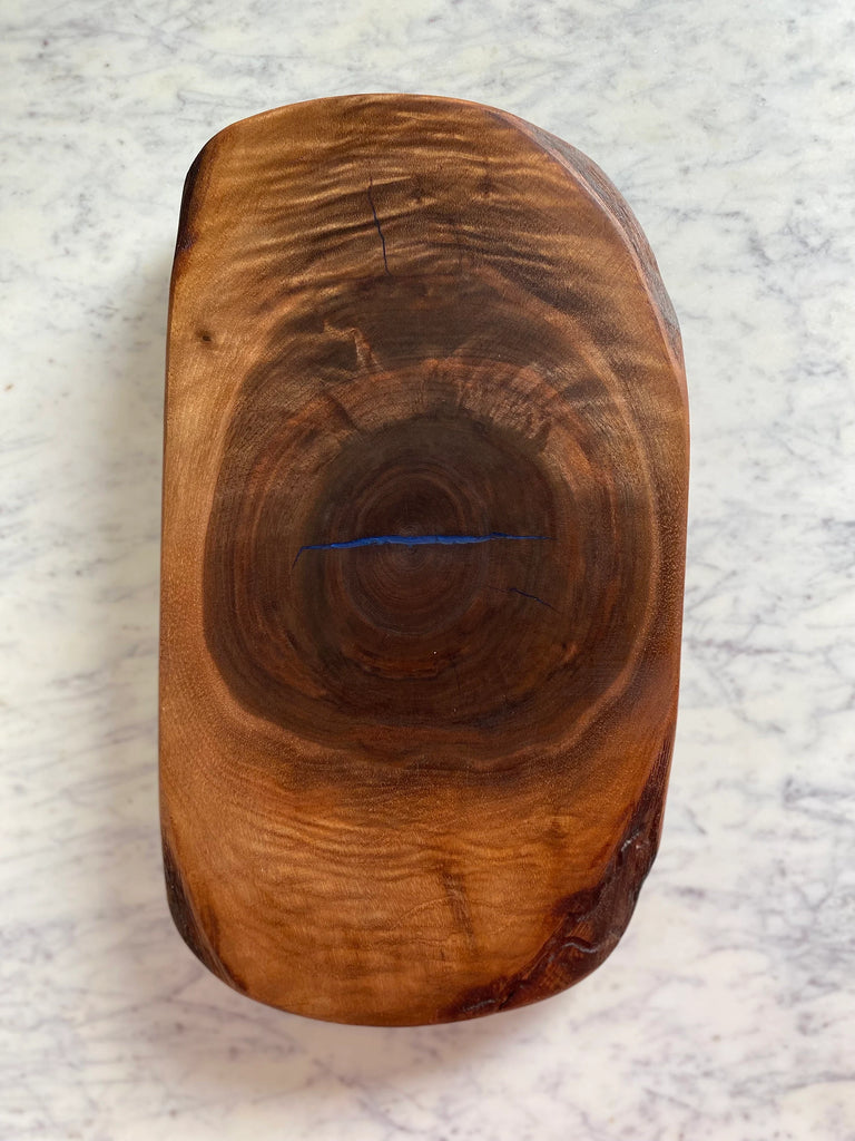 handcrafted dark walnut wood cutting board with epoxy