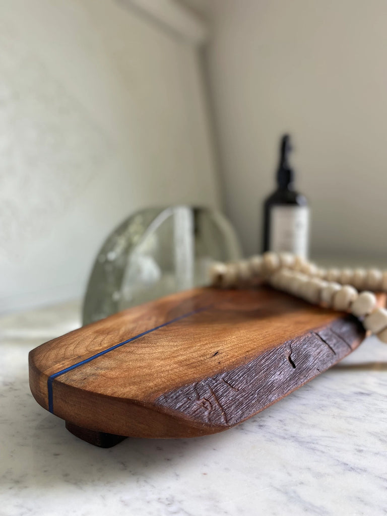 handmade dark walnut wood cutting board with epoxy