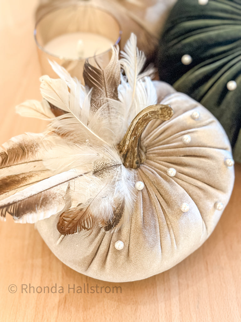 Cream custom velvet pumpkin with pearls and feathers